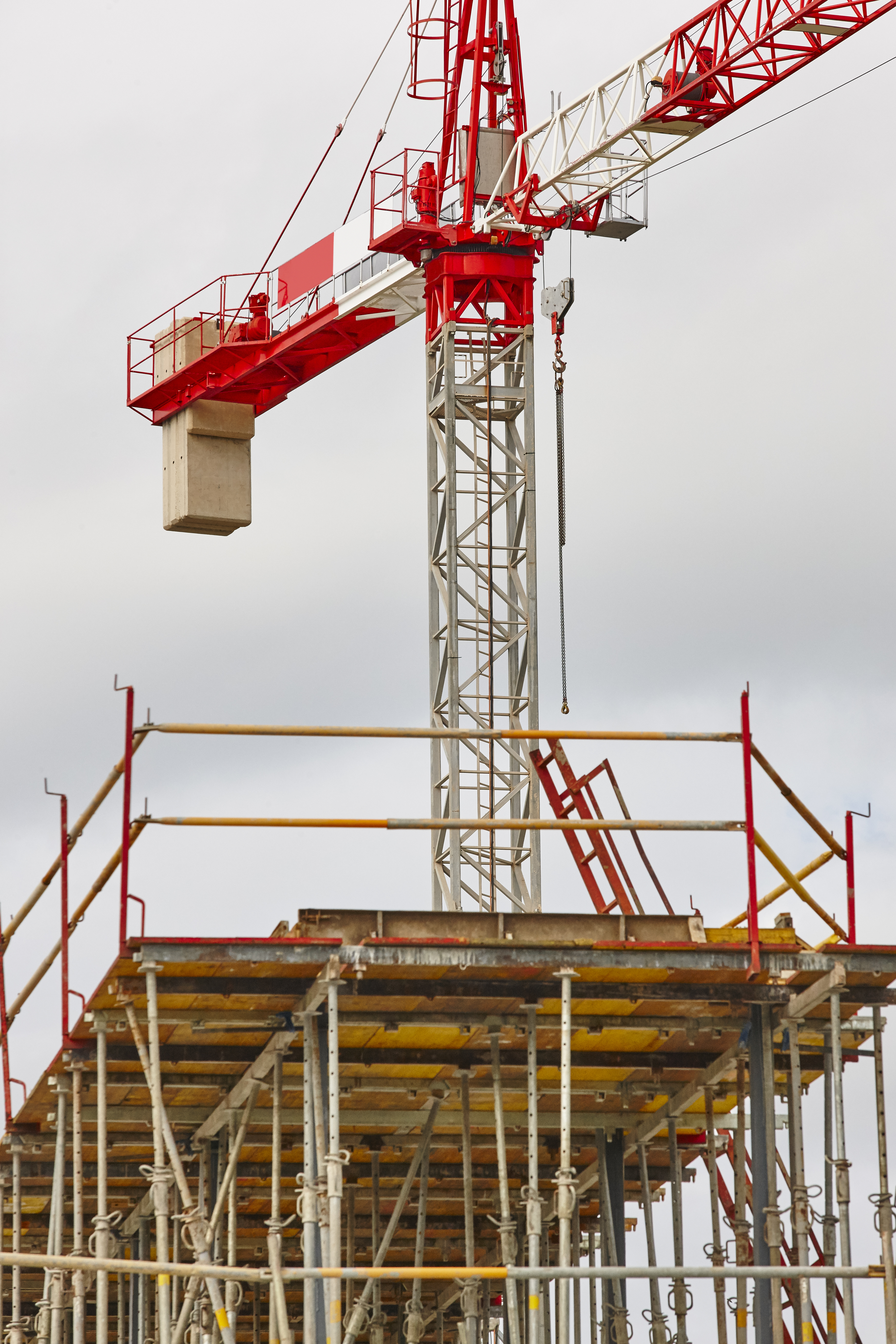 Building under construction. Crane machinery structure. Industry